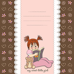 Image showing sweet little girl reading a book