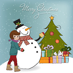 Image showing Cute little girl with snowman