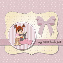 Image showing sweet little girl reading a book