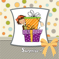 Image showing cute little girl hidden behind boxes of gifts. happy birthday gr