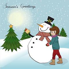 Image showing Cute little girl with snowman
