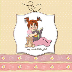 Image showing sweet little girl reading a book