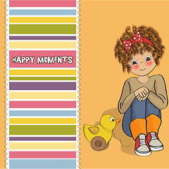 Image showing curly girl play with her duck toy