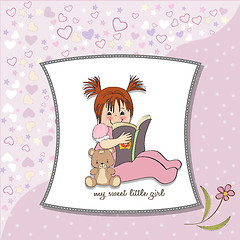 Image showing sweet little girl reading a book