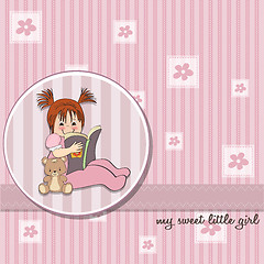 Image showing sweet little girl reading a book