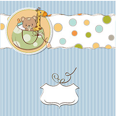 Image showing new baby announcement card with bag and same toys