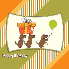 Image showing three dogs that offer a big gift. birthday greeting card