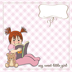 Image showing sweet little girl reading a book