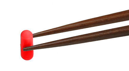 Image showing Chopsticks with capsule