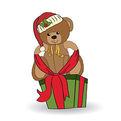 Image showing cute teddy bear with a big Christmas gift box