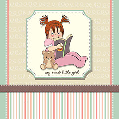 Image showing sweet little girl reading a book