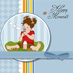 Image showing funny lovely little girl blowing soap bubbles