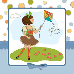 Image showing cute teens who are playing with a kite