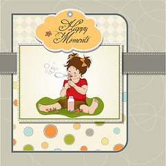 Image showing funny lovely little girl blowing soap bubbles