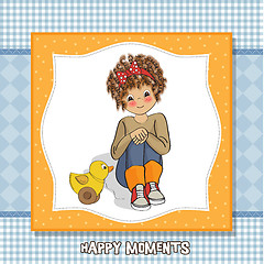 Image showing curly girl play with her duck toy