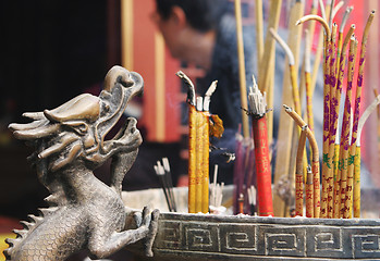 Image showing Incense burning at a temple.