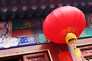 Image showing Bright red lantern hanging at a temple