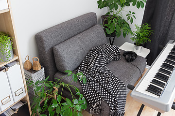 Image showing Armchair and electric piano in a musician's home