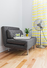 Image showing Living room with armchair and electric fan