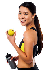 Image showing Eat healthy, stay fit. Smiling chinese girl