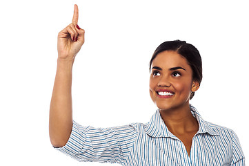 Image showing Corporate woman pointing upwards