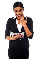 Image showing Excited businesswoman holding touch pad