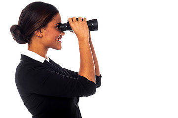 Image showing Corporate woman viewing through binoculars