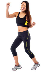 Image showing Cheerful fitness trainer dancing in joy