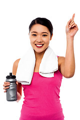 Image showing Smiling fitness woman holding sipper bottle