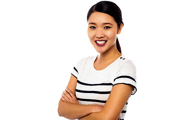 Image showing Pretty asian girl posing sweetly with confidence