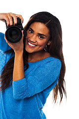 Image showing Woman taking a snap, smile please