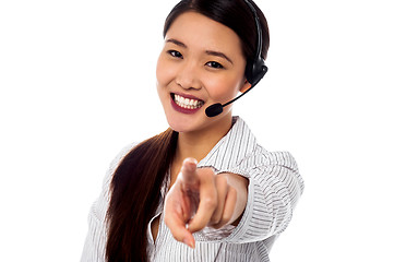 Image showing Call centre support staff pointing towards camera