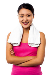 Image showing Fit smiling woman with towel around her neck