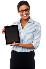 Image showing Sales representative displaying tablet pc for sale