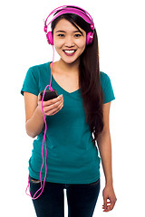 Image showing Pretty girl listening to music