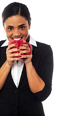 Image showing Woman enjoying coffee during work break
