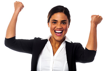 Image showing Excited woman with clenched fists