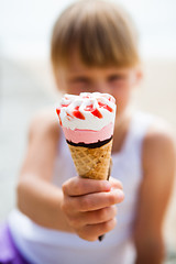 Image showing Ice cream held by young girl