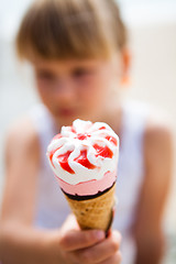 Image showing Ice cream held by young girl