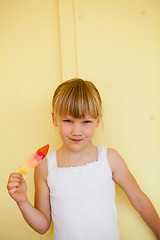 Image showing Young girl holding with popsicle