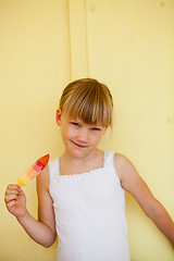 Image showing Young girl holding with popsicle