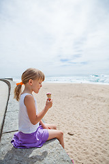 Image showing Girl with ice cream near beach