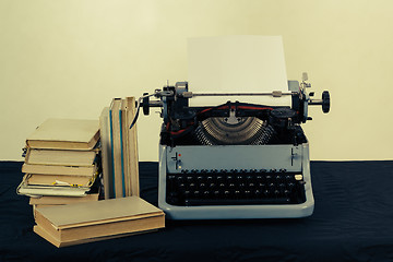 Image showing Old typewriter with books retro colors on the desk