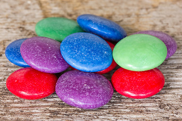 Image showing Colorful candy on the wooden background