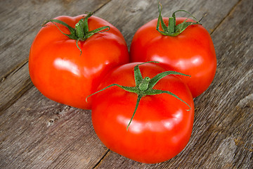 Image showing Tomatoes on the old wooden floor