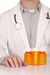 Image showing  Doctor With Empty Orange Prescription Bottles