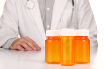 Image showing Doctor With Empty Orange Prescription Bottles