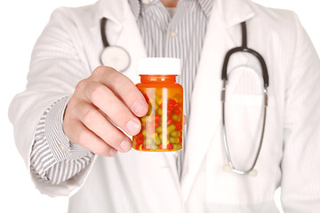 Image showing Doctor With Medication in Prescription Bottles
