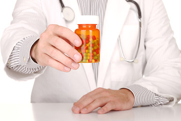 Image showing Doctor With Medication in Prescription Bottles
