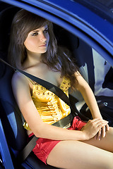 Image showing girl in car fastened by seat belt